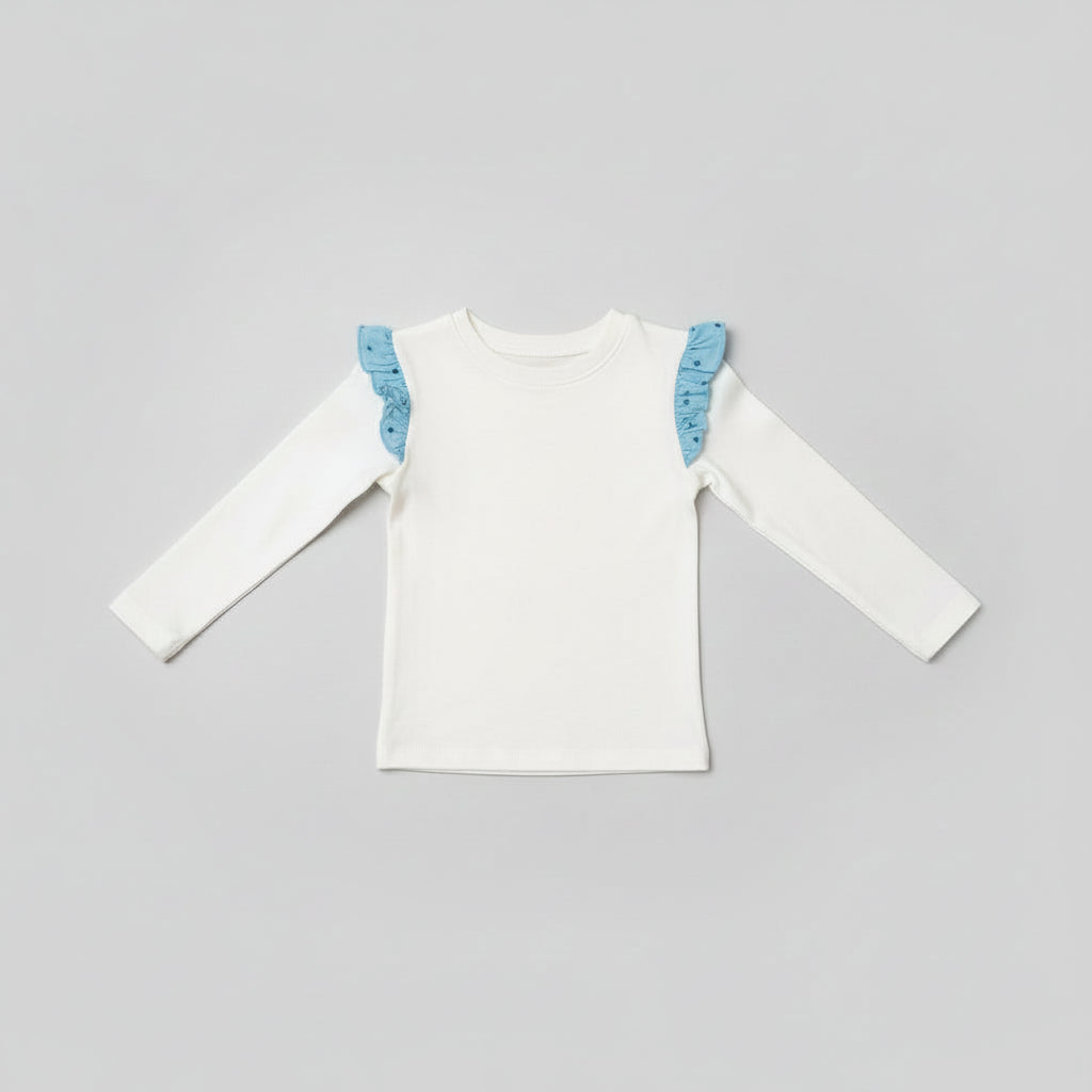 Back view of ivory toddler long-sleeve top with blue printed ruffle shoulder accents.