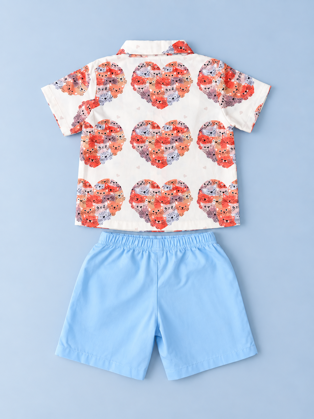Back view of boys cat heart print collared shirt and solid light blue shorts set