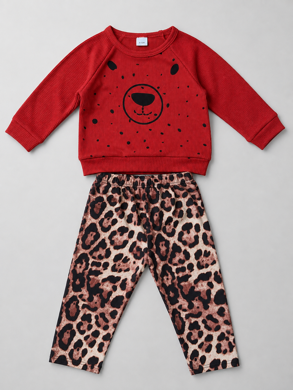 Adorable girls 2-piece outfit featuring a cozy waffle-knit bear sweatshirt and trendy leopard print leggings. Perfect for fall, winter, school, playdates, and everyday boutique fashion.