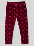 A pair of dark red velvet leggings with an all-over pink heart pattern, featuring an elastic waistband and a small bow at the center front, shown flat on a light gray background.