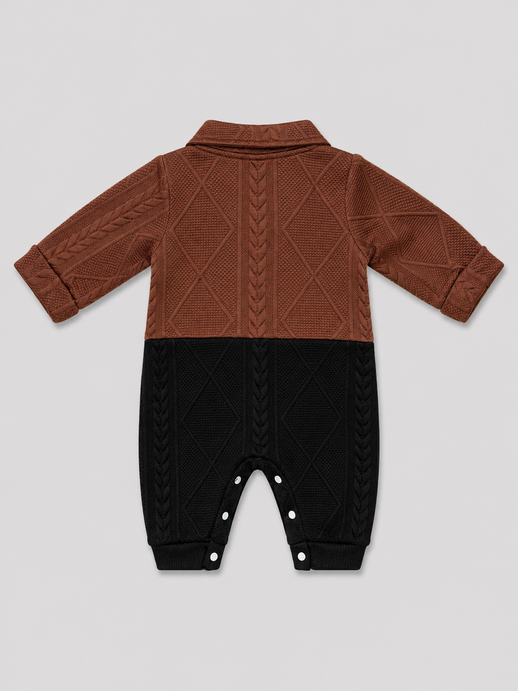Shop this stylish brown, cream, and black cable knit baby romper featuring a textured design, collared neckline, button front, and convenient snap closures. Perfect for baby boys or girls.