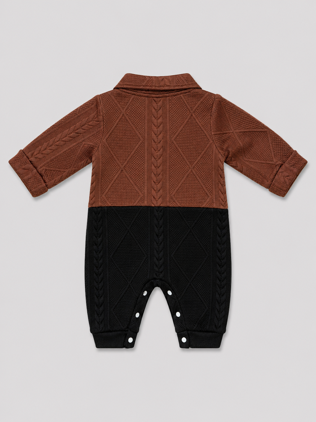 Shop this stylish brown, cream, and black cable knit baby romper featuring a textured design, collared neckline, button front, and convenient snap closures. Perfect for baby boys or girls.