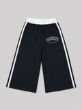 Black athletic shorts featuring white side stripes, an elastic waistband, and a “Brooklyn New York” graphic. A versatile choice for school, sports, playtime, and everyday casual wear.