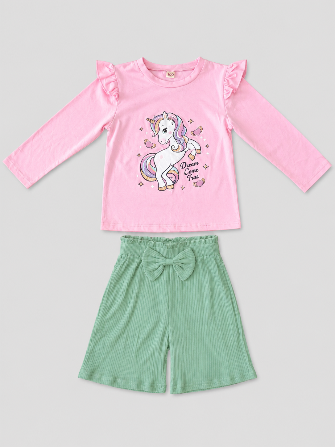 Shop this adorable girls’ unicorn 2-piece outfit featuring a pink long-sleeve top with a colorful unicorn graphic and coordinating mint green bow shorts. Perfect for everyday wear and special occasions.
