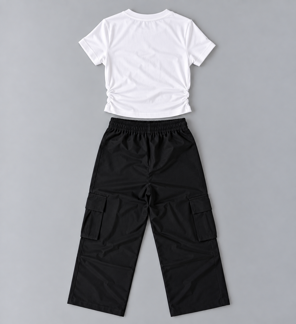 Back view of girls white ruched-side short-sleeve top with black elastic-waist cargo pants