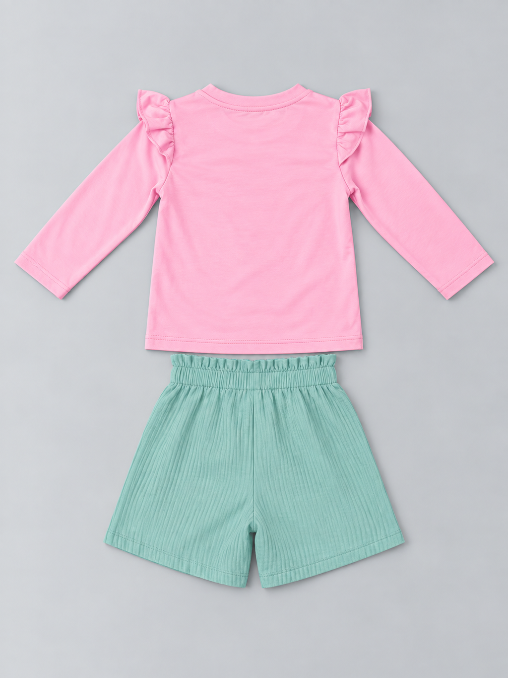 Girls pink long-sleeve top and mint green textured elastic-waist shorts set, back view
Shopify Tags