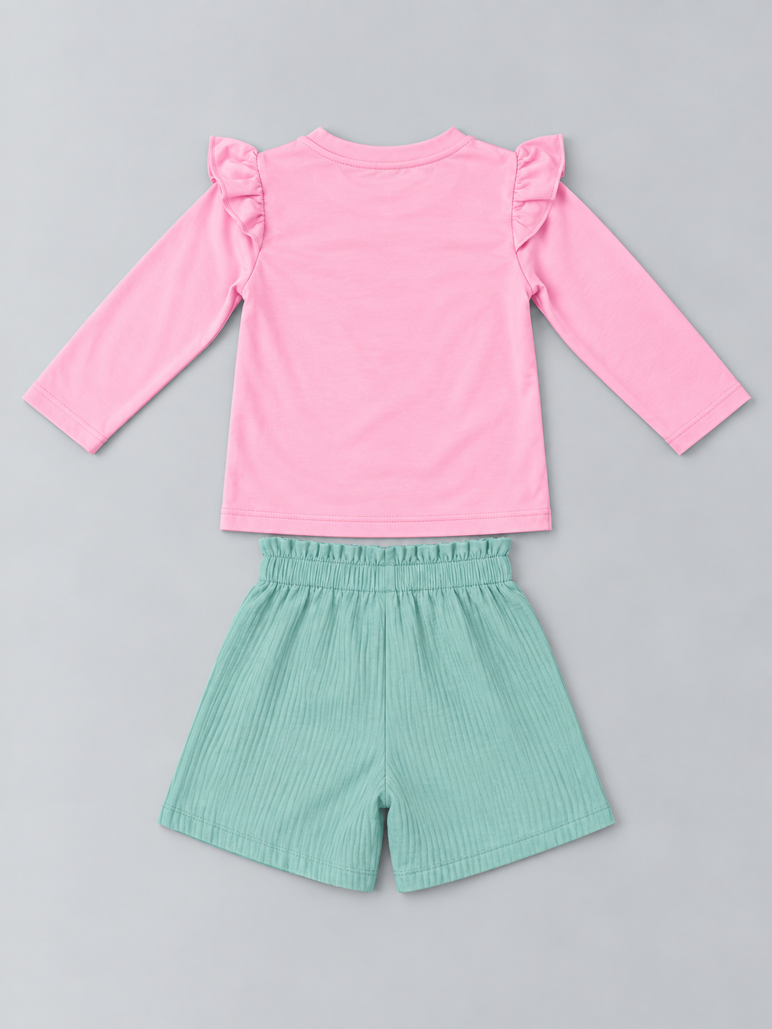 Girls pink long-sleeve top and mint green textured elastic-waist shorts set, back view
Shopify Tags