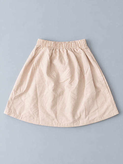 Girls beige skirt with elasticized back waistband and flared silhouette