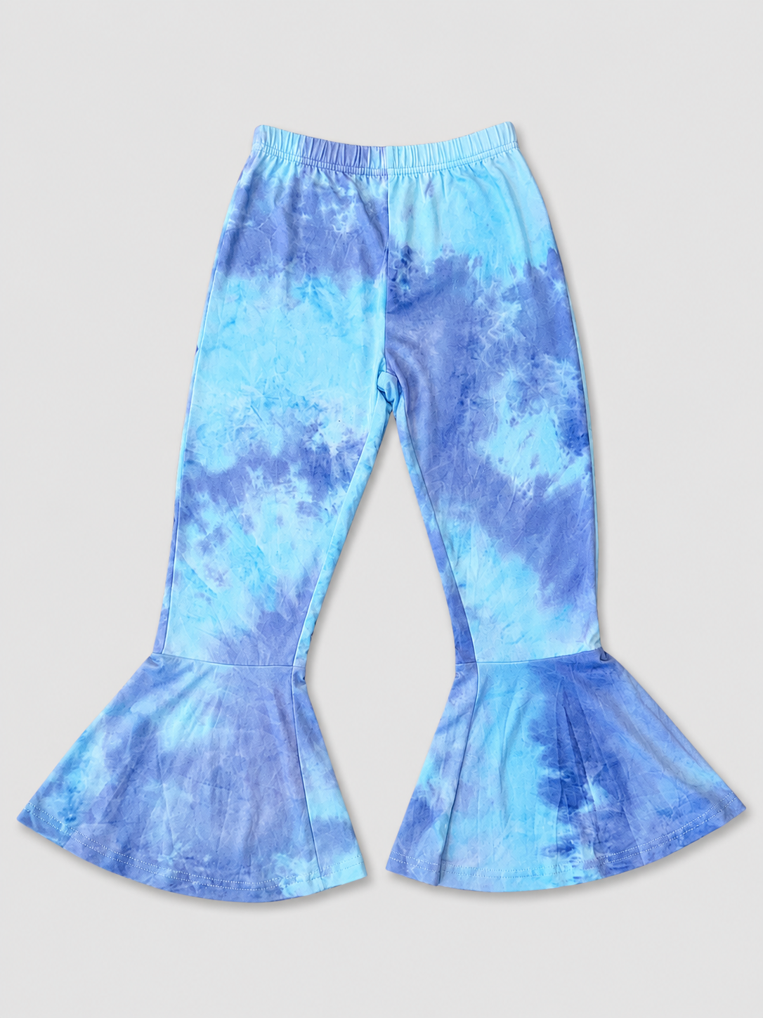 Girls blue tie-dye bell bottom pants featuring a soft stretchy fabric, elastic waistband, and trendy flare-leg design. Perfect boutique-style leggings for everyday wear, school, and special occasions.