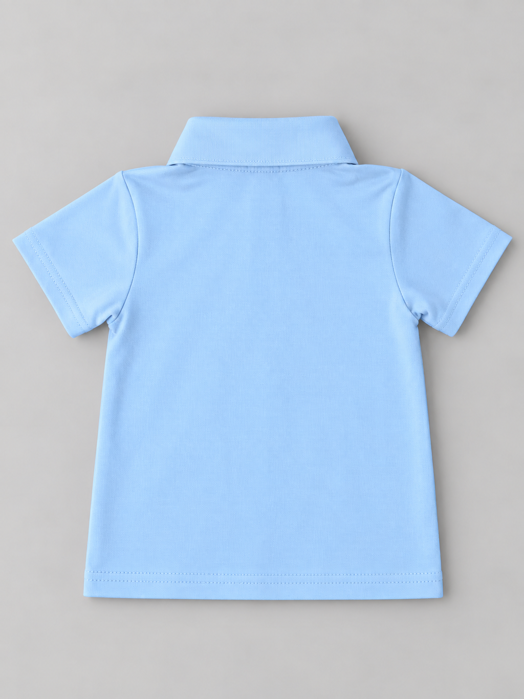 Back view of boys solid light blue short sleeve polo shirt with classic collar