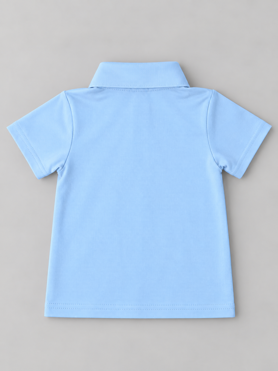 Back view of boys solid light blue short sleeve polo shirt with classic collar