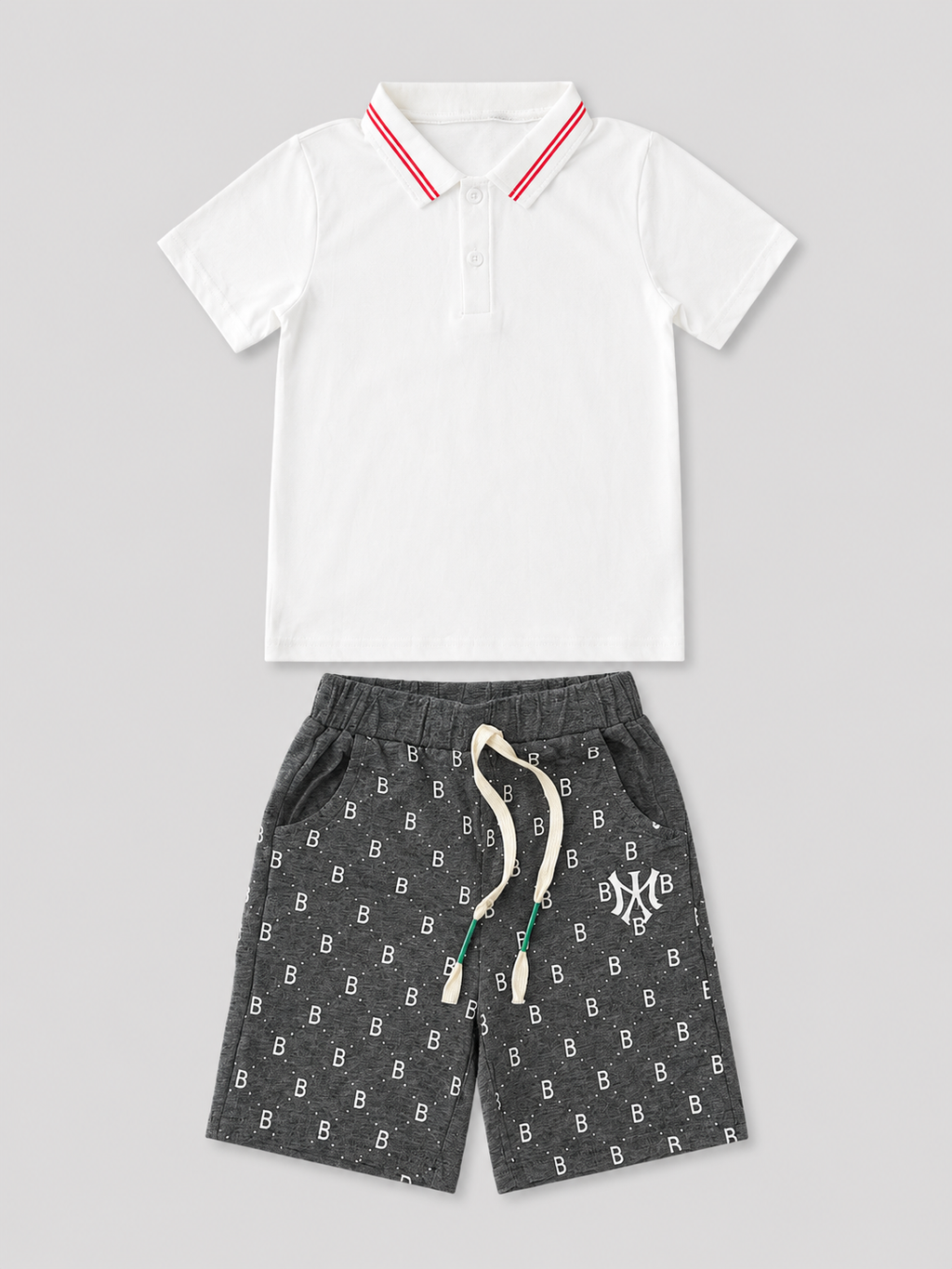 Boys white short-sleeve polo shirt with red striped collar and charcoal gray printed drawstring shorts two-piece set, front view, size 6Y.