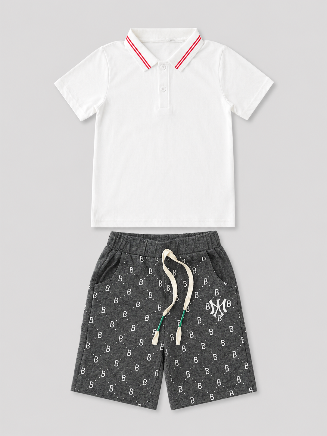 Boys white short-sleeve polo shirt with red striped collar and charcoal gray printed drawstring shorts two-piece set, front view, size 6Y.