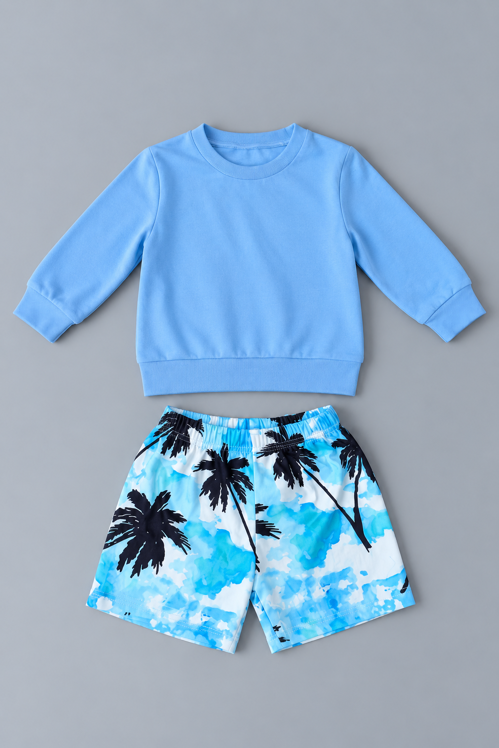 Boys blue long-sleeve sweatshirt with blue white and black palm tree print shorts two-piece outfit