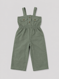 Olive green utility-style jumpsuit for girls featuring a comfortable elasticized waist, wide-leg pants, shoulder straps, and button-flap pocket details. Perfect for casual everyday wear, vacations, and summer outfits.